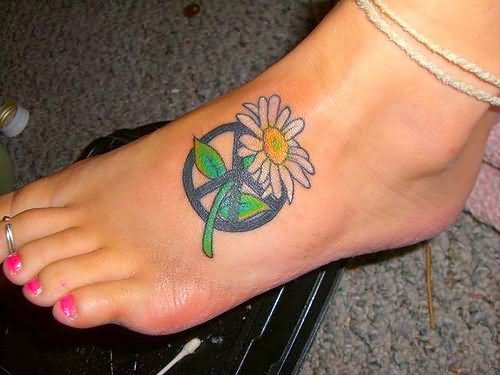 Hippie Flower With Peace Logo Tattoo On Girl Foot