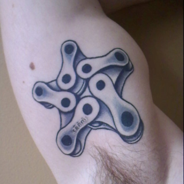 Inner Bicep Motorcycle Chain Star Tattoo