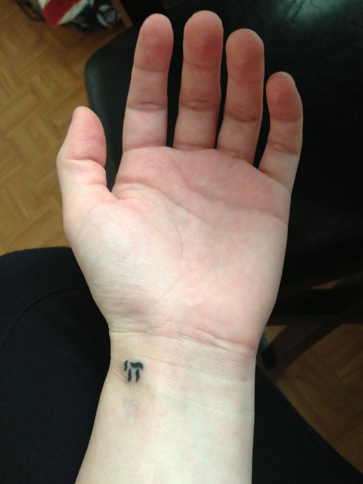 Little Hebrew Symbol Tattoo On Left Wrist