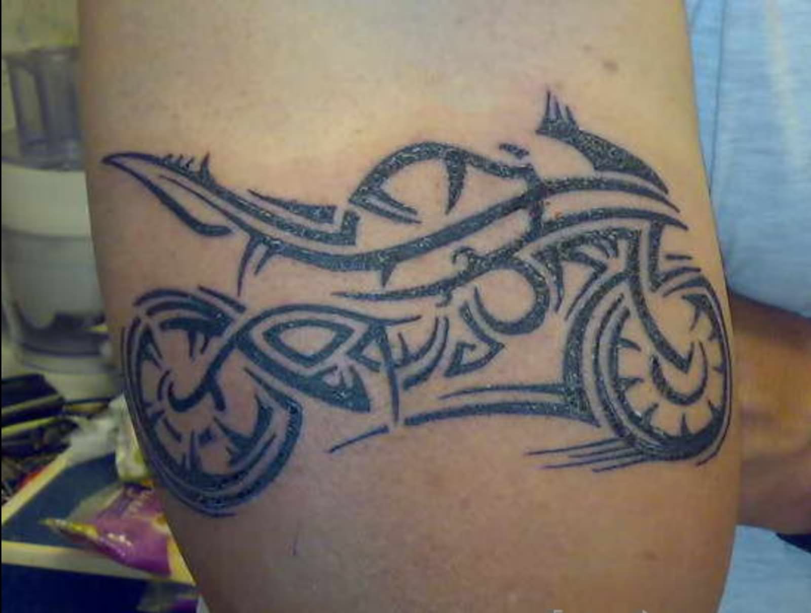 Nice Black Tribal Motorcycle Tattoo On Leg