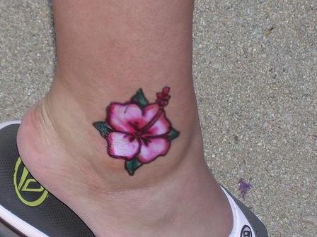 Pink Ink Hawaiian Flower Tattoo On Ankle