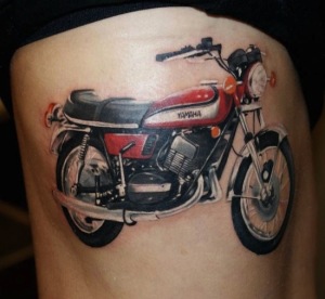 Red Motorcycle Tattoo On Side Rib