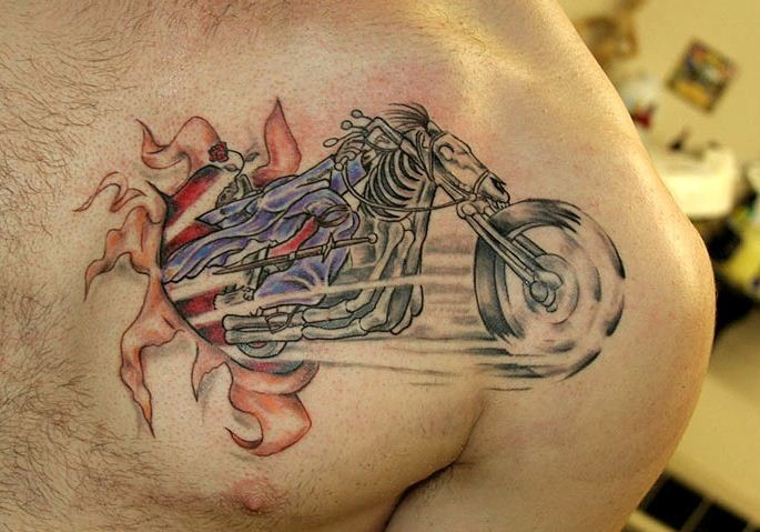 Ripped Skin Motorcycle Tattoo On Front shoulder