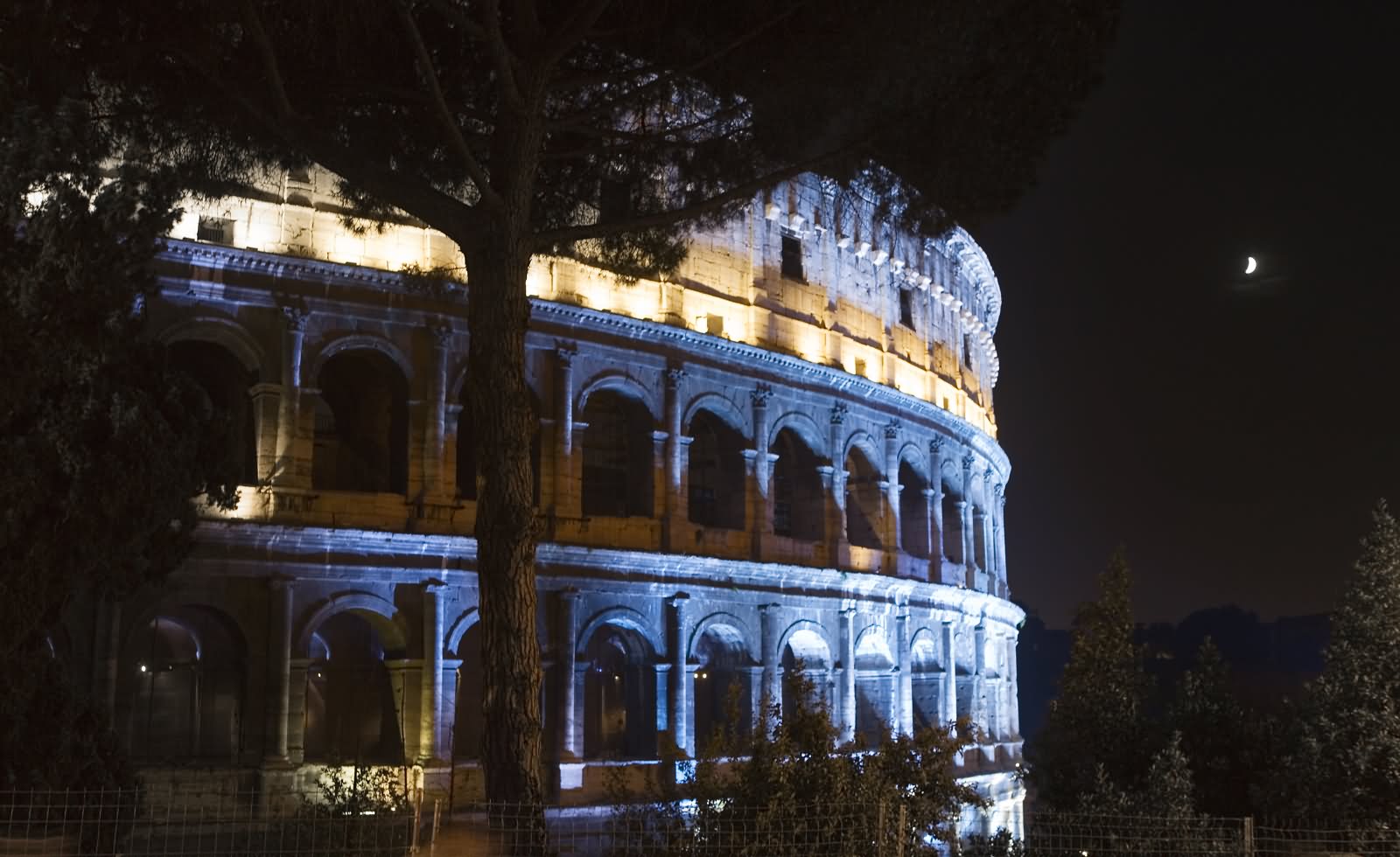 Side View Image Of The Colosseum At Night
