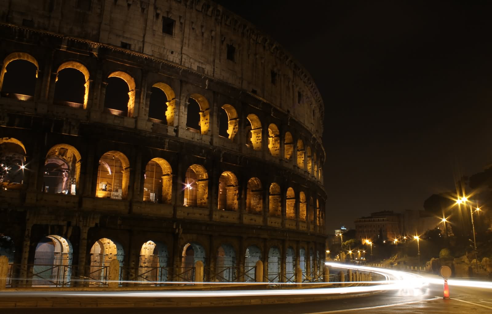 Side View Of The Colosseum At Night