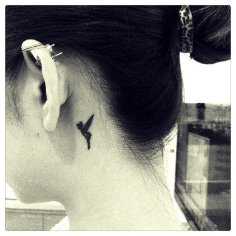 Silhouette Little Tinkerbell Tattoo On Girl Behind The Ear