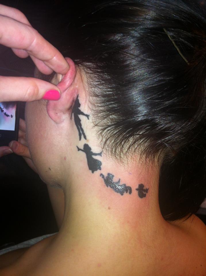Silhouette Tinkerbell And Peter Pan Tattoo On Girl Behind The Ear