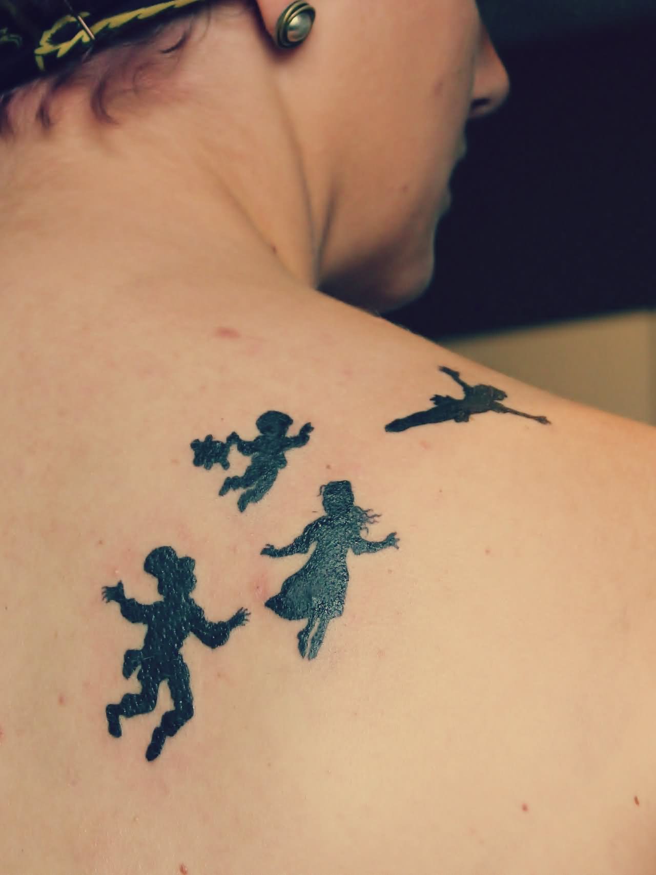 Silhouette Tinkerbell And Peter Pan Tattoo On Right Back Shoulder