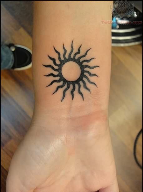 Simple Black Hippie Sun Tattoo On Girl Wrist