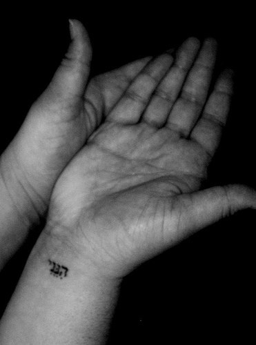 Simple Hebrew Lettering Tattoo On Right Wrist