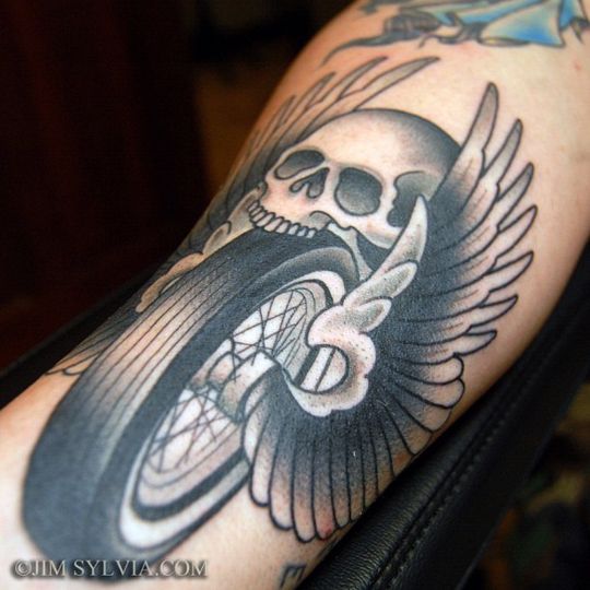 Skull And Winged Motorcycle Wheel Tattoo