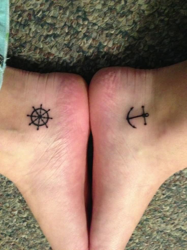 Small Black Sailor Wheel And Friendship Anchor Tattoos On Heel