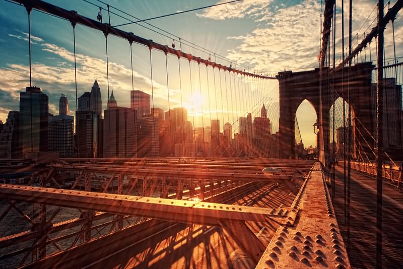 Sunset Over The Brooklyn Bridge And Manhattan City