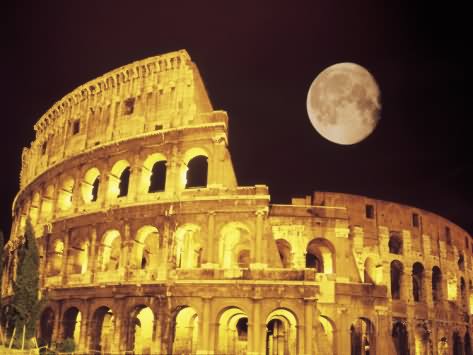 The Colosseum At Night With Full Moon