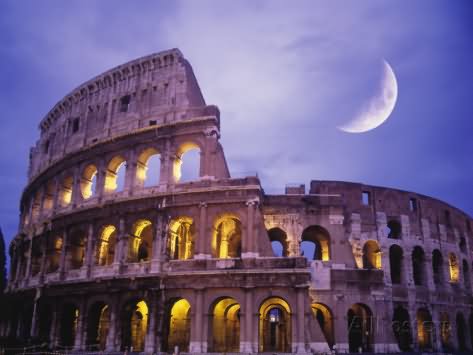 The Colosseum At Night With Half Moon