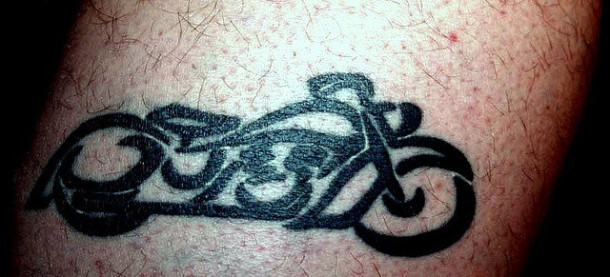 Tribal Motorcycle Tattoo On Bicep