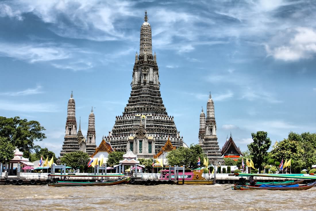 Wat Arun Temple On Chao Pharaya River With Boats