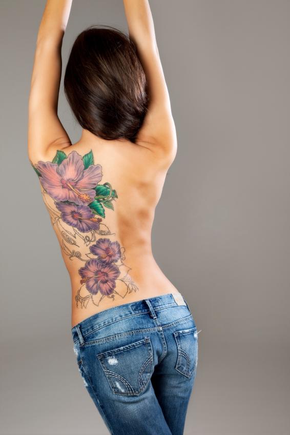 Awesome Feminine Flowers Tattoo On Girl Full Back