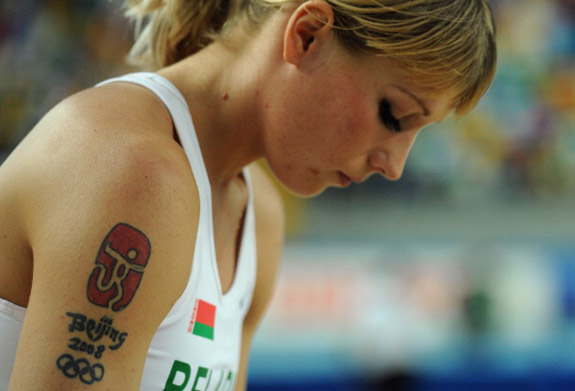Beijing 2008 Beijing Logo With Olympic Symbol Tattoo On Girl Right Shoulder
