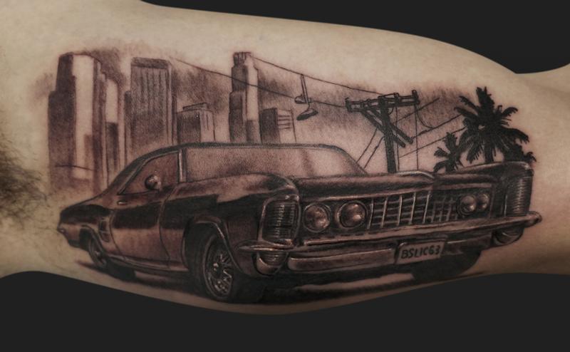 Black And Grey Car Tattoo On Inner Bicep