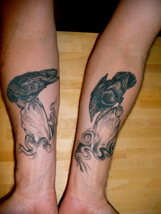 Black And Grey Hugin And Munin Tattoos On Forearm