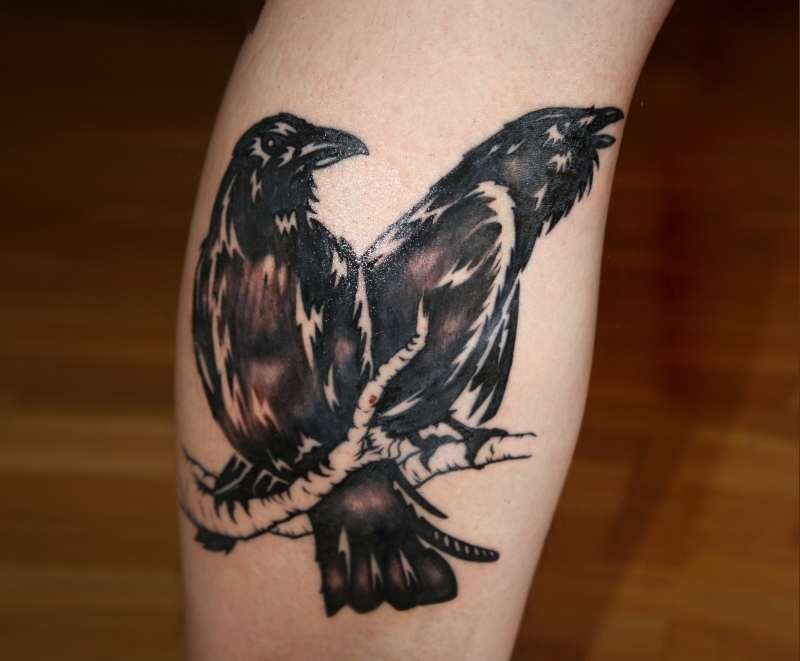 Black Ink Hugin And Munin Tattoo On Leg