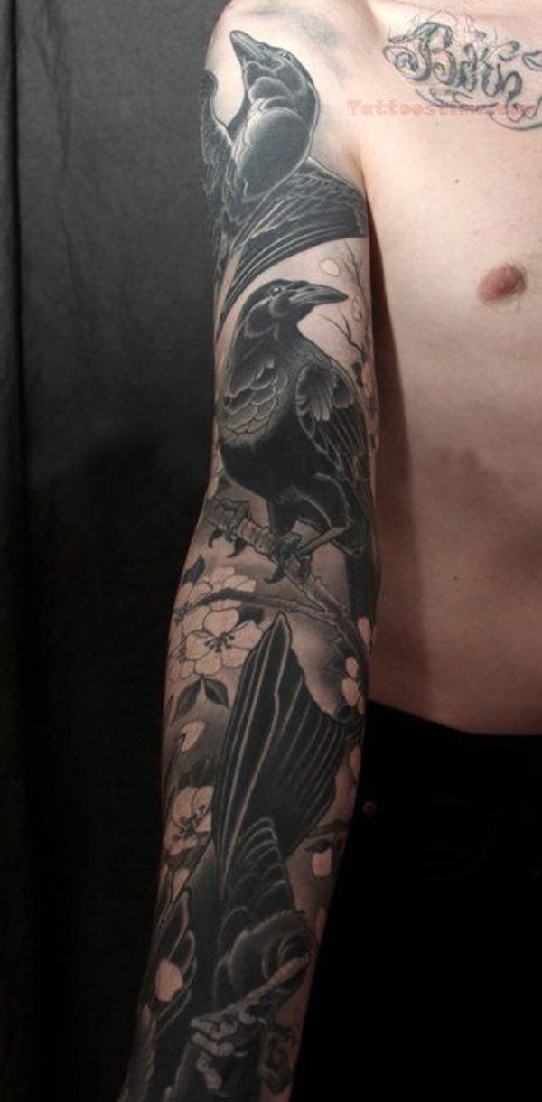 Black Ink Raven Tattoo On Man Right Sleeve