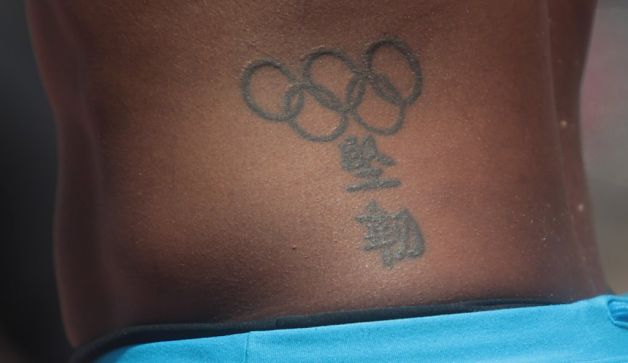 Black Olympic Symbol Tattoo Design For Side Rib