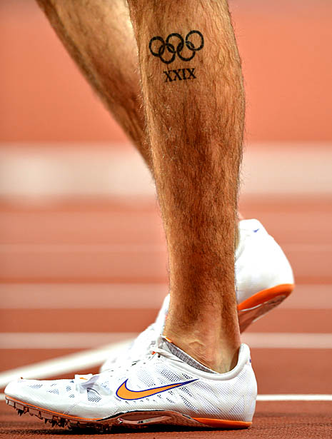 Black Olympic Symbol Tattoo On Man Left Leg