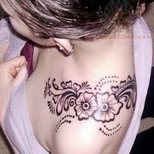 Black Outline Feminine Flowers Tattoo On Girl Left Upper Shoulder