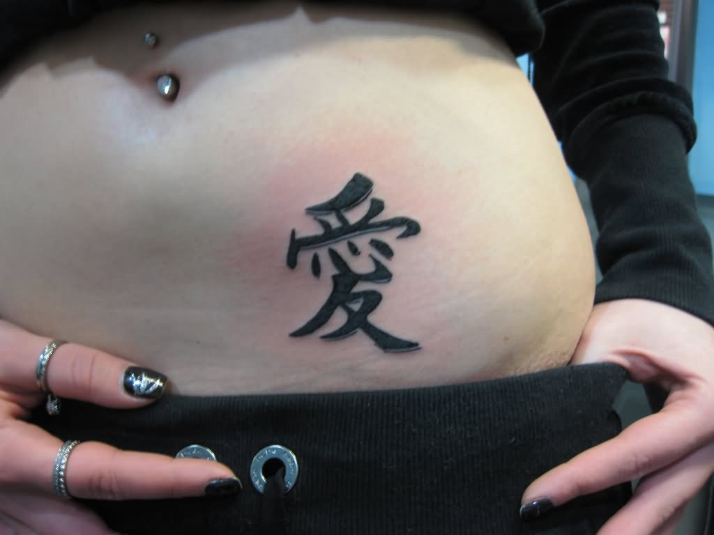 Black kanji Tattoo On Girl Waist