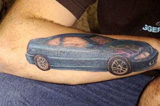 Blue Car Tattoo On Right Arm
