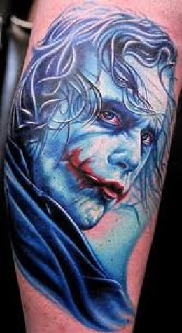 Blue Ink Joker Tattoo On Arm