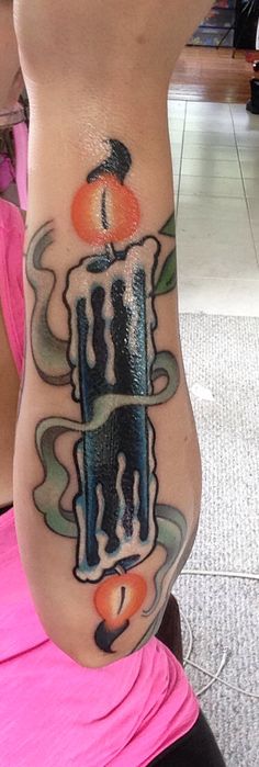 Candle burning on both ends tattoo on Girl's arm