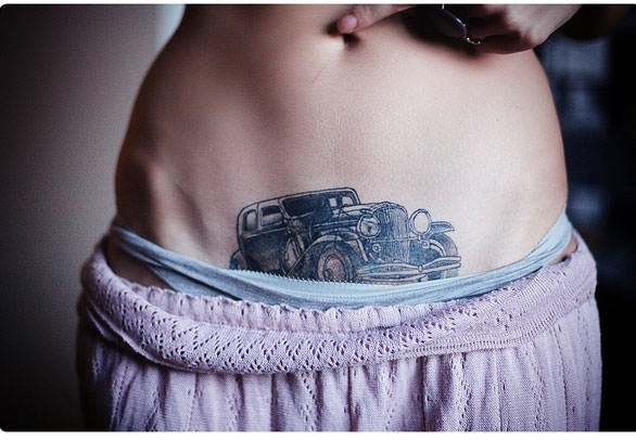 Car Tattoo On Girl Belly