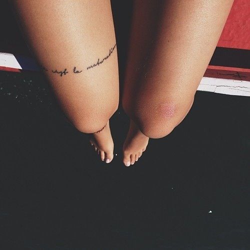 Classic Feminine Script Tattoo On Girl Thigh
