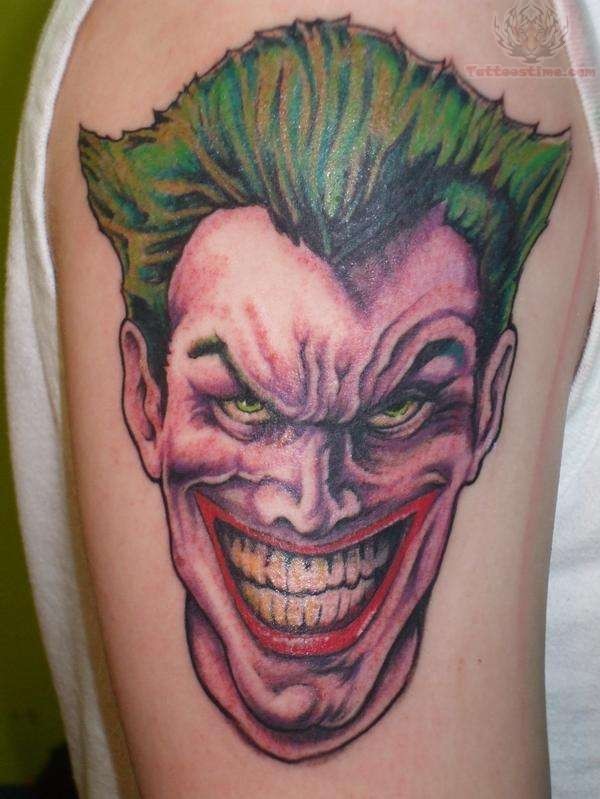 Colored Joker Head Tattoo On Right Bicep