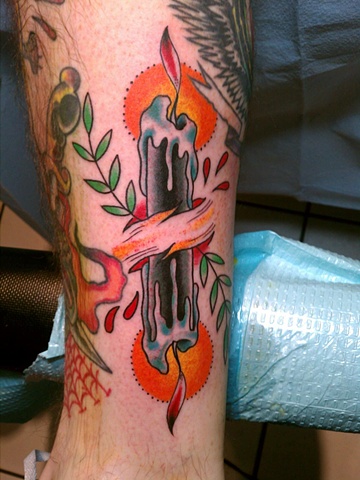 Colorful Candle burning at both ends tattoo on leg