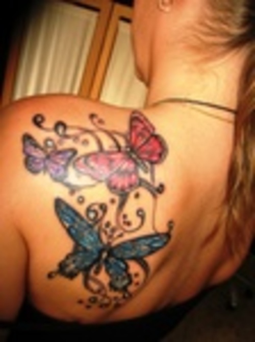 Colorful Feminine Butterflies Tattoo On Girl Left Back Shoulder