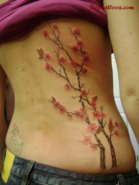 Colorful Feminine Flowers Tattoo Design For Side Rib