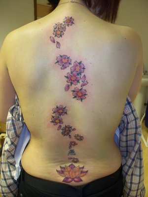 Colorful Feminine Flowers Tattoo On Girl Full Back
