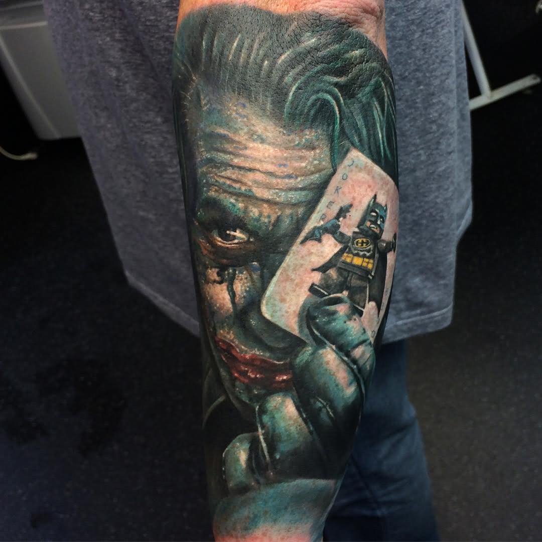 Colorful Joker Card Tattoo On Left Sleeve