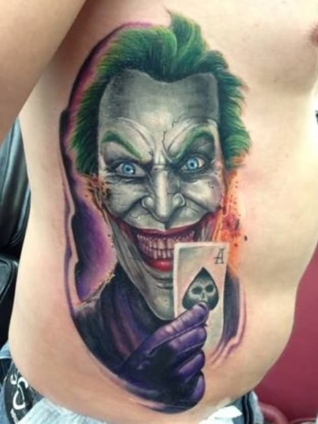 Colorful Joker With Card Tattoo On Man Side Rib