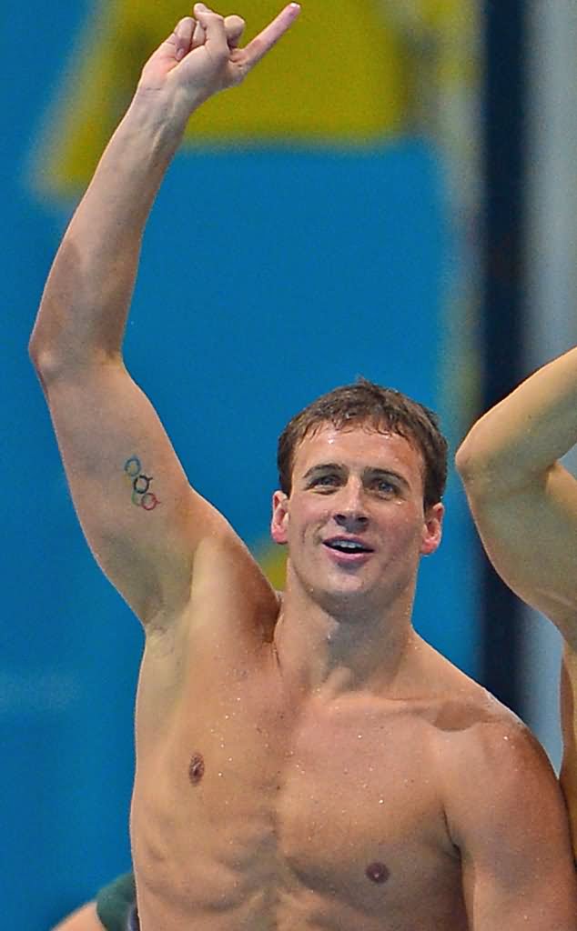Colorful Olympic Symbol Tattoo On Ryan Lochte Right Bicep