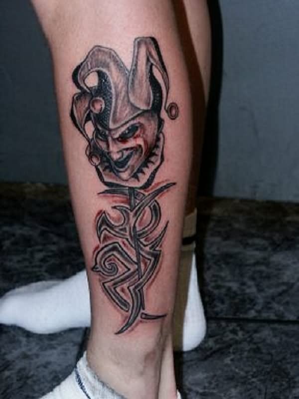 Cool Tribal And Joker Head Tattoo On Side Leg