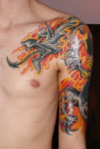 Dragon In Fire And Flame Tattoo On Man Left Shoulder