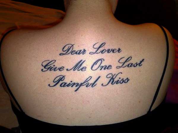 Feminine Quote Tattoo On Upper Back