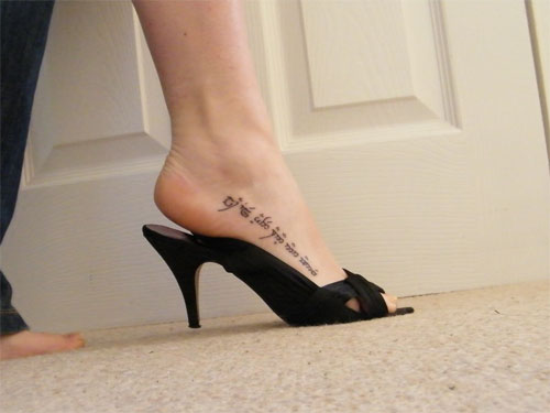 Feminine Script Tattoo On Girl Heel