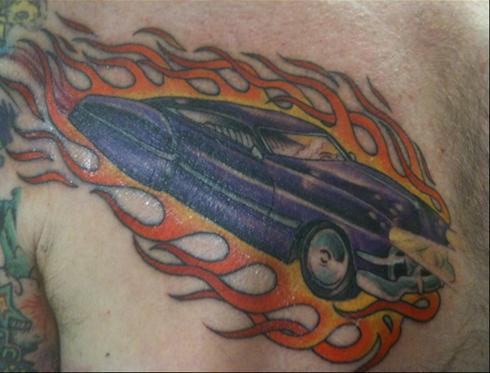 Flaming Car Tattoo On Front Shoulder