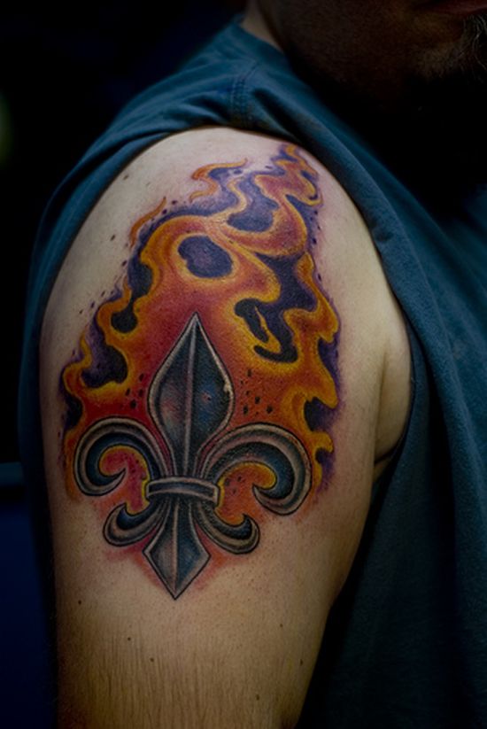 Fleur De Lis In Fire And Flame Tattoo On Man Right Shoulder